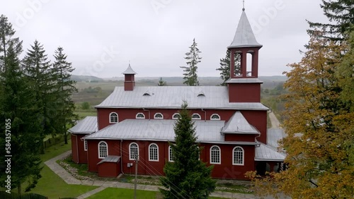 Aerial shot of the beautiful Church of the Holy Trinity and St. Casimir in Medininkai, Lithuania photo