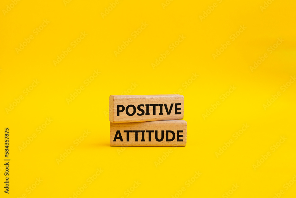 Positive attitude symbol. Concept words Positive attitude on wooden blocks. Beautiful yellow background. Business and Positive attitude concept. Copy space. Positive attitude symbol. Concept words Positive attitude on wooden blocks. Beautiful yellow background. Business and Positive attitude concept. Copy space.