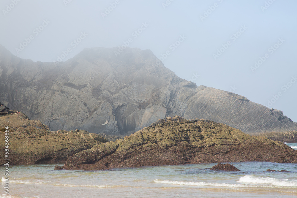 Sea, Cliffs and Rock Formation With Mist at Odeceixe Beach; Algarve; Portugal