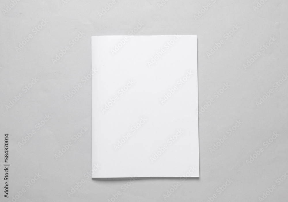 Magazine mockup with white cover on gray background. Template for design Magazine mockup with white cover on gray background. Template for design