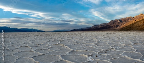 Panoramic top view of the saltflats in the Death Valley under blue cloudy sky in California photo