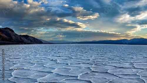Top view of the saltflats in the Death Valley under blue cloudy sky in California photo