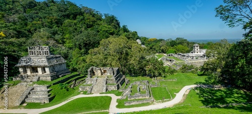 Scenic aerial view of Palenque ruins and pyramids under blue sky in Mexico