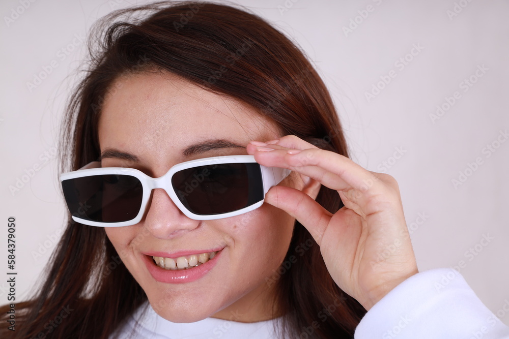 Close up portrait of young woman wearing glamour sun glasses Close up portrait of young woman wearing glamour sun glasses