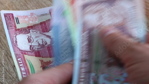 Guatemala money, Counting cash, Financial and economic concept, Currency of Guatemala called quetzales
