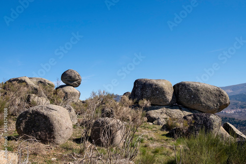 Formation of large granite rocks in a mountain range photo