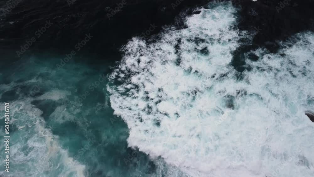 White Frothy Ocean Waves Rushing Over Rugged Coastline In Caion Beach, Coruna Spain. Aerial Drone Shot White Frothy Ocean Waves Rushing Over Rugged Coastline In Caion Beach, Coruna Spain. Aerial Drone Shot
