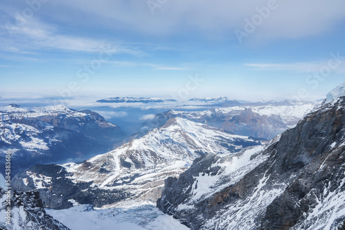 Magica view of the Alps mountains in Switzerland. View from helicopter in Swiss Alps. Mountain tops in snow. Breathtaking view of Jungfraujoch and the UNESCO World Heritage - the Aletsch Glacier