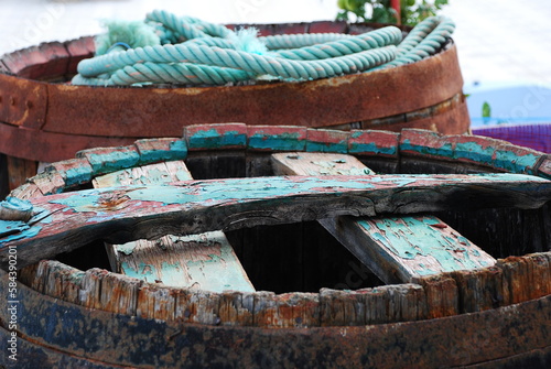 Old rusted barrels in a port