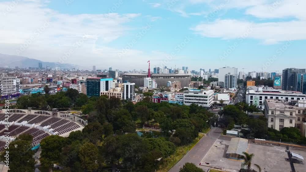 Video of the National Stadium of Lima along with the cityscape of the city. Video from a drone. Video of the National Stadium of Lima along with the cityscape of the city. Video from a drone.