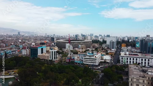 Video of the National Stadium of Lima along with the cityscape of the city. Video from a drone.
