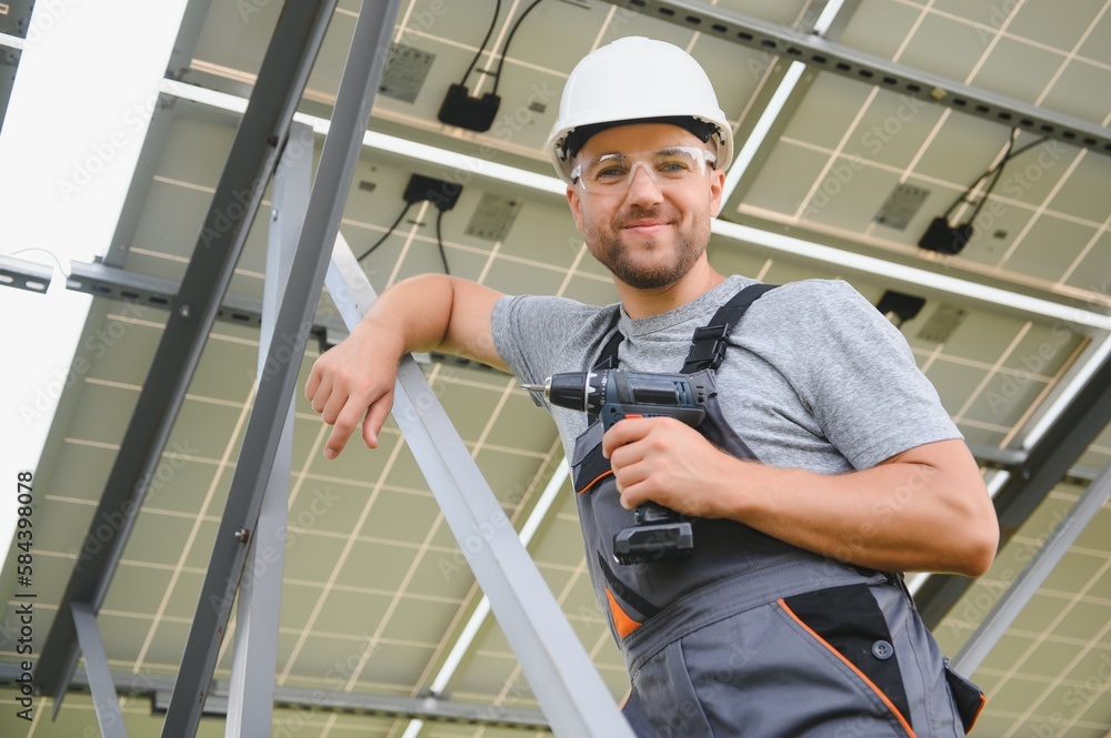 A man working at solar power station. A man working at solar power station.