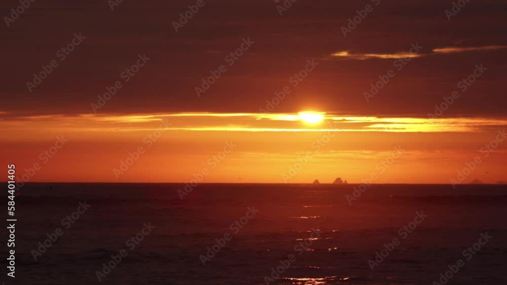 video of a dramatic sunset over the ocean with storm clouds in the sky. (Lima, Perú) video of a dramatic sunset over the ocean with storm clouds in the sky. (Lima, Perú)