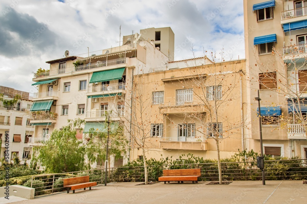 Naklejka premium Typical street in city Athens without poeple during cloudy day