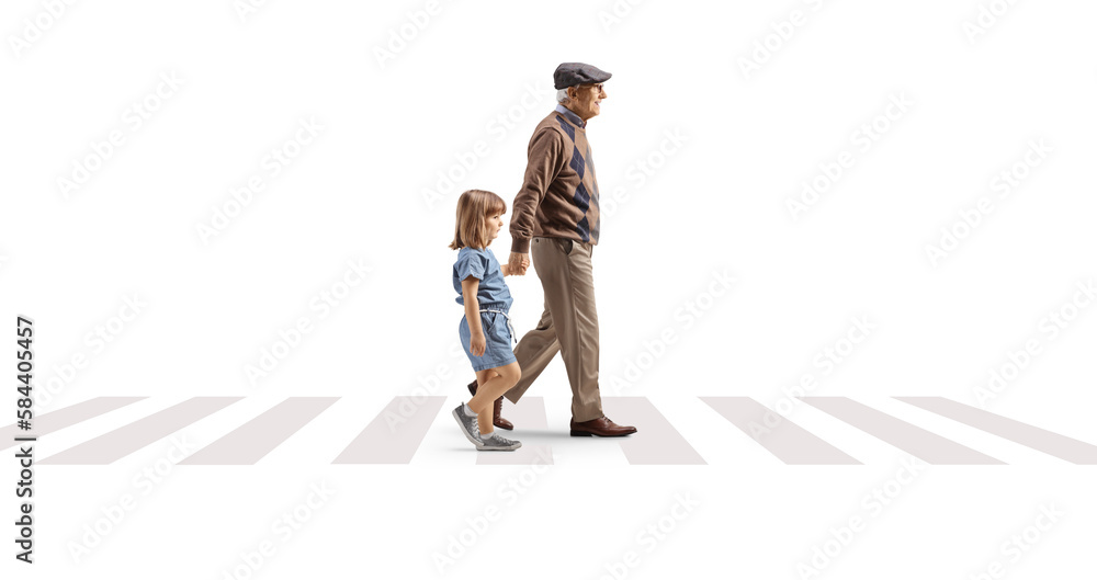 Full length profile shot of a grandfather crossing street with a child Full length profile shot of a grandfather crossing street with a child