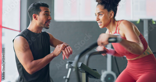 Fitness couch, gym athlete and training time of a woman workout and man with a sports watch. Exercise, motivation and health cardio together for wellness and healthy living in a coaching class