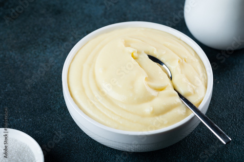 Εκτύπωση καμβά Glass jar with vanilla pudding. Custard cream. Traditional cream