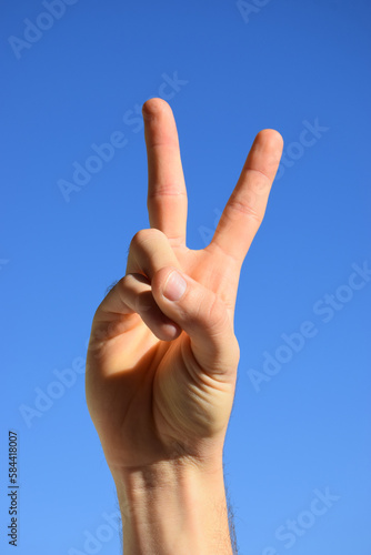 Hand showing peace sign
