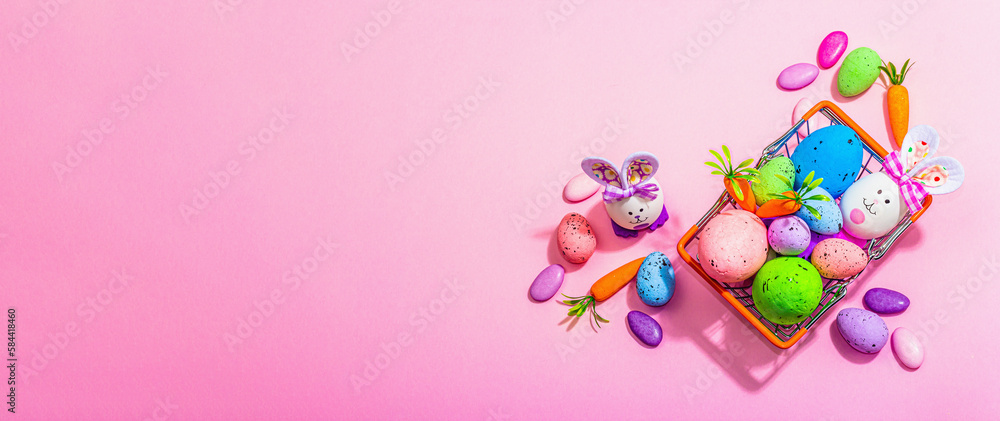 Easter sale concept. Shopping basket with festive symbols - rabbit, eggs, bird, traditional decor Easter sale concept. Shopping basket with festive symbols - rabbit, eggs, bird, traditional decor
