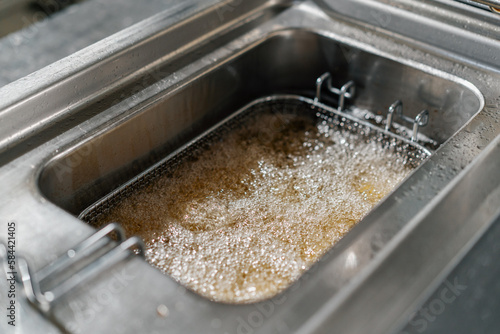 professional kitchen in the hotel restaurant hot oil for deep-frying fries