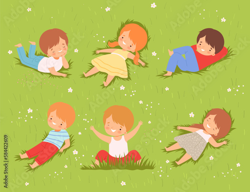 Happy Kids Lying Down on Green Lawn and Smiling Vector Set