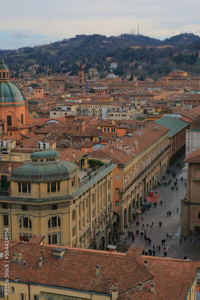 Obraz premium Top view of the historic center of the Italian city of Bologna on a cloudy day. The Bolognese hills are in the background.