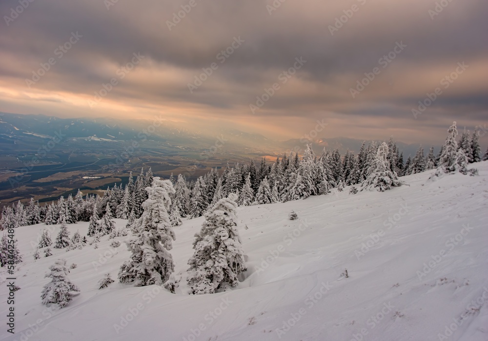 Fantastic evening winter landscape. Dramatic overcast sky. Beauty world. Hiking in the mountains, a healthy lifestyle Fantastic evening winter landscape. Dramatic overcast sky. Beauty world. Hiking in the mountains, a healthy lifestyle