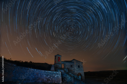 Εκτύπωση καμβά Benalua, Granada-Spain; October, 02 - 2021; The hermitage of San Torcuato shines under a mesmerising starry night sky, with the stars revolving around the North Star in a captivating dance