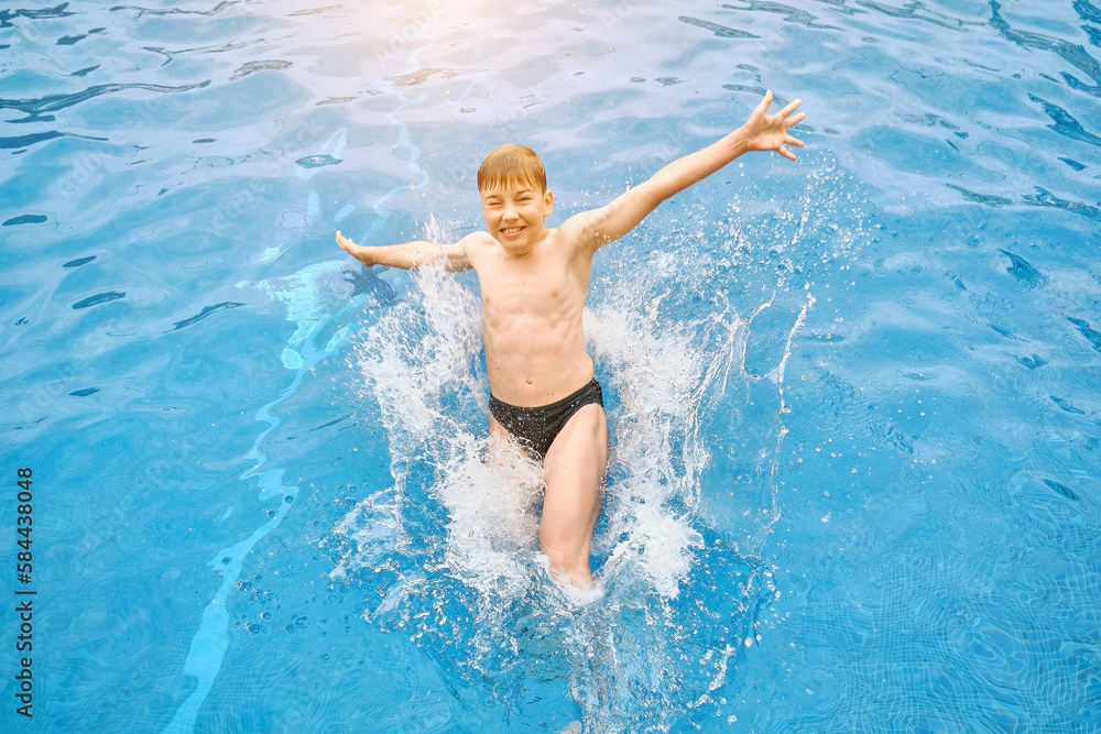 Child jump, swim in the pool, sunbathes, swimming in hot summer