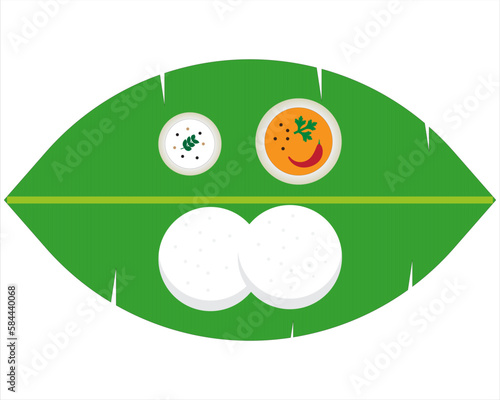 Idly dish along with sambar and chutney served in traditional style with Banana leaf .