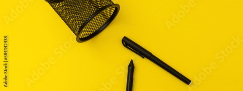 Office with pens on yellow background, banner photo