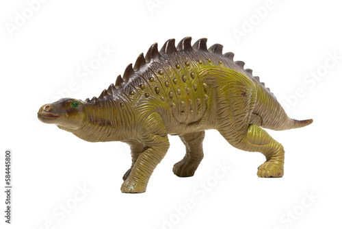Close up of a plastic dinosaur toy with spikes on its back isolated on white background.