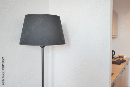 a lamp in home against white wall 