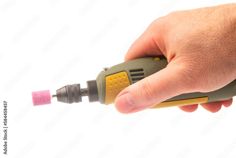 graver and drilling electric tool on a white background. dremel for processing materials and repairing parts graver and drilling electric tool on a white background. dremel for processing materials and repairing parts