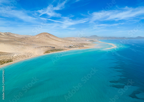 Stunning high aspect aerial panoramic view of the beautiful tropical looking beach, lagoon and sand dunes at SotaventoRisco del Paso beach near Costa Calma on Fuerteventura Canary Islands Spain