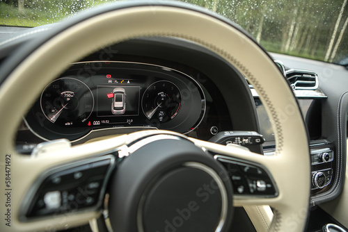 steering wheel in expensive leather in a premium car © AvokadoStudio