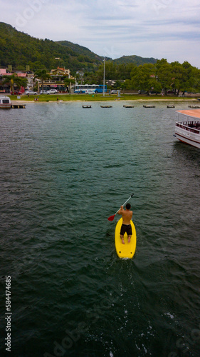 Boats Ocean Island Sea Canoe Standup Sail Yatch Kayak Tropical Landscape Sun Summer Fishing Vessel Nature Catamara Sunny Summer Travel Traveling Transport Paddle Wind Ship Sky Blue Nautical  photo