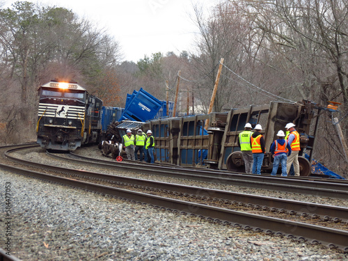 Ayer, Massachusetts/USA - 3/23/2023 - Norfolk Southern locomotives work to put together the rest of train #265 after at least 5 well cars carrying trash and recyclables derailed this morning. photo