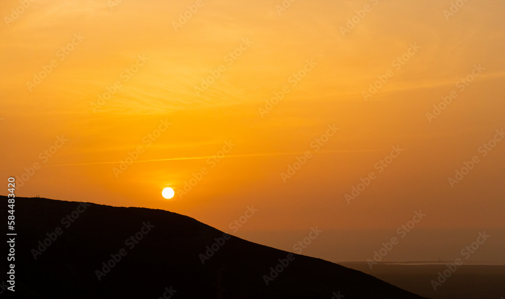 Obraz premium Beautiful and dramatic sunset colours over the volcanic mountain range near Corralejo in Fuerteventura Canary Islands Spain