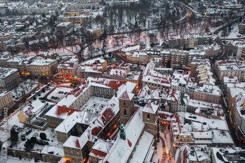 Aerial view of a snowy old German town, aerial view of the snow-covered roofs of houses, winter landscape © Vladyslav