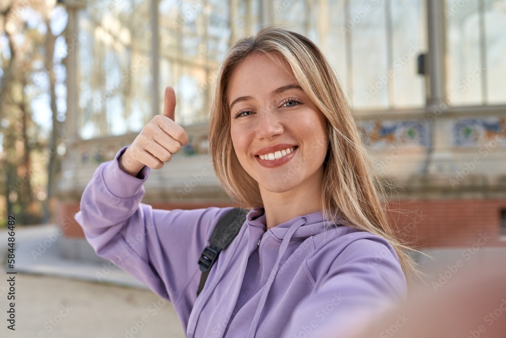 Young caucasian woman captures ancient beauty in a selfie moment. Young caucasian woman captures ancient beauty in a selfie moment.
