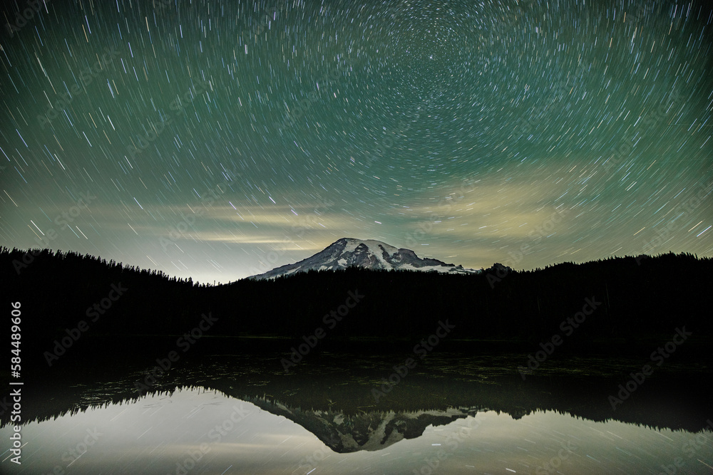 Mount Mount Rainier with the star trails and lake reflection
