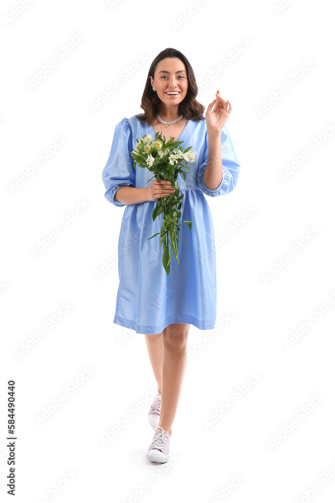Young woman in blue dress with alstroemeria flowers on white background Young woman in blue dress with alstroemeria flowers on white background