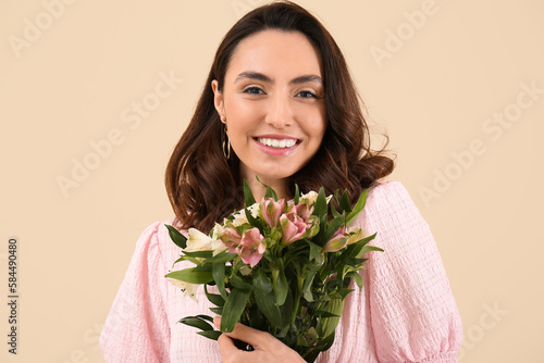 Young woman in pink dress w...