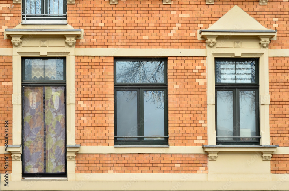 View of brick building with wooden windows View of brick building with wooden windows