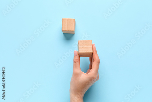Woman with wooden cubes on ...
