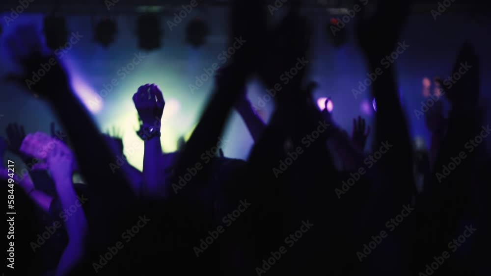 Concert crowd waving hands in the club. People party with music and enjoy amazing show on the stage. Video is in slow motion. Concert crowd waving hands in the club. People party with music and enjoy amazing show on the stage. Video is in slow motion.