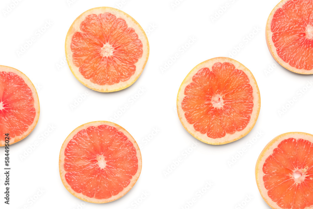 Composition with slices of ripe grapefruit on white background