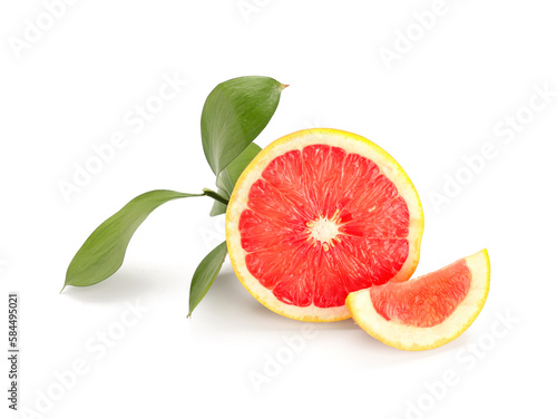 Half of ripe grapefruit and plant branch on white background