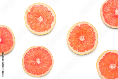 Composition with slices of ripe grapefruit on white background